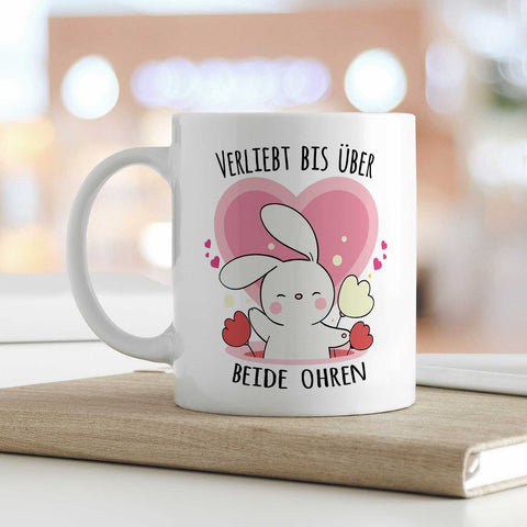 Bedruckte Tasse mit Spruch - Verliebt bis über beide Ohren