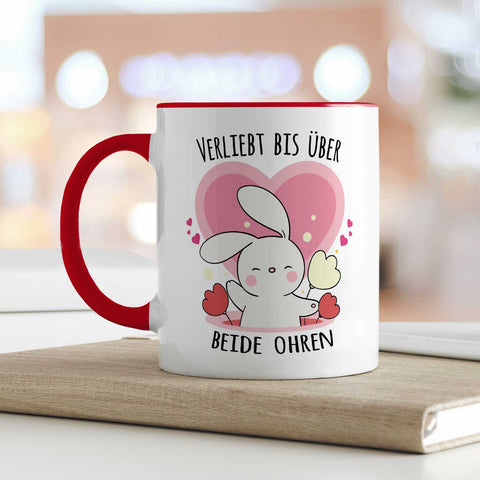 Bedruckte Tasse mit Spruch - Verliebt bis über beide Ohren