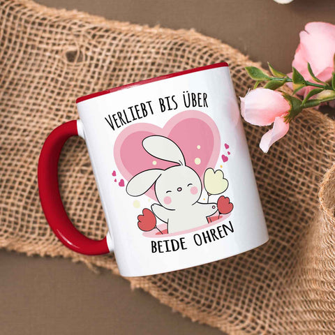 Bedruckte Tasse mit Spruch - Verliebt bis über beide Ohren