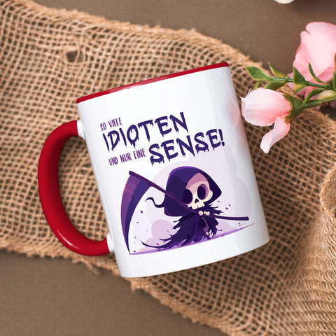 Bedruckte Tasse mit Spruch in lila - So viele Idioten und nur eine Sense