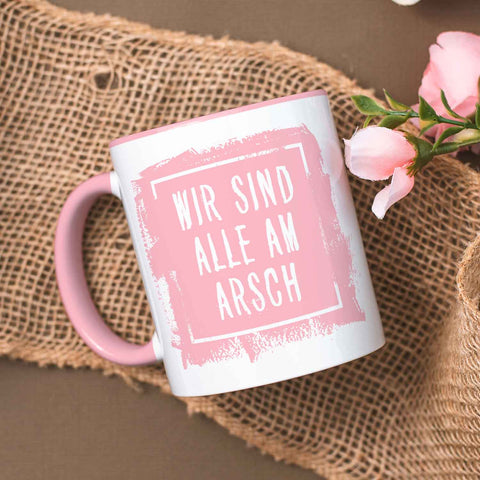 Bedruckte Tasse mit Spruch - "Wir sind alle am Arsch"