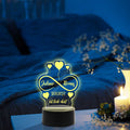 Graviertes Acrylglas im Unendliche Liebe Design mit LED-Sockel