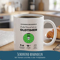 Tasse Oldtimer mit Prüfplakette zum Frühstück